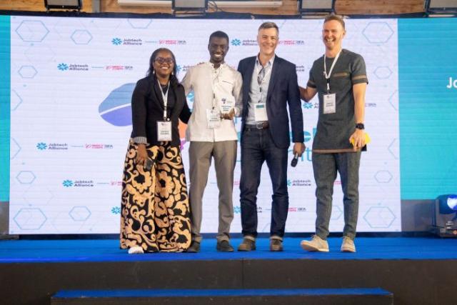 Serigne receiving an award from Jobtech at #AJS2025, Nairobi.