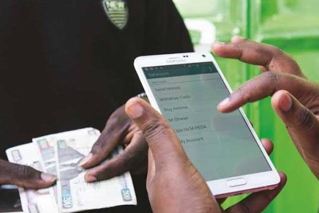 A picture showing money being deposited to an M-Pesa account